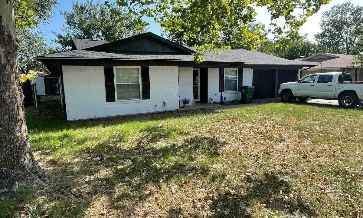 Professional roofing crew working on a residential roof in Normandy Park